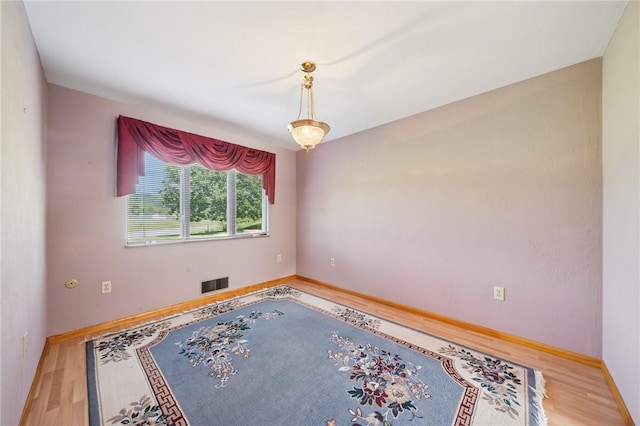 318 E Edgewood Ave, Trafford, PA 15085 - spare room featuring wood finished floors and baseboards