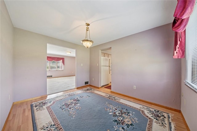 318 E Edgewood Ave, Trafford, PA 15085 - spare room featuring wood finished floors and baseboards