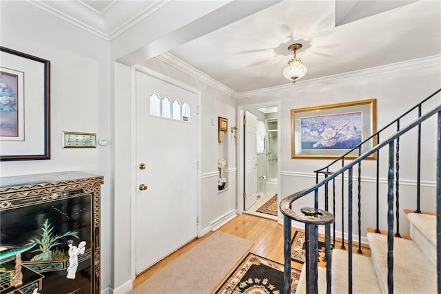 145 Herbst Rd, Kennedy Twp, PA 15108 - entrance foyer with wood finished floors, stairs, and ornamental molding