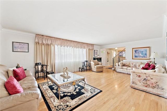 145 Herbst Rd, Kennedy Twp, PA 15108 - living room with crown molding, stairs, and wood finished floors