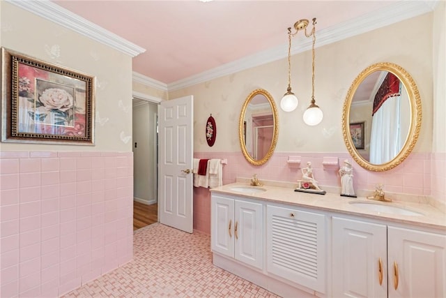 145 Herbst Rd, Kennedy Twp, PA 15108 - full bathroom featuring tile walls, double vanity, a wainscoted wall, crown molding, and tile patterned flooring