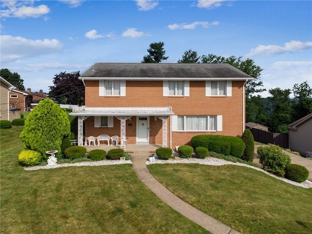 145 Herbst Rd, Kennedy Twp, PA 15108 - traditional-style house featuring a porch and brick siding