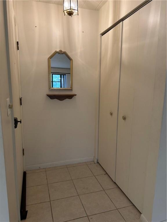 403 Piper Ln, Twp Of But Nw, PA 16001 - corridor with light tile patterned flooring and baseboards