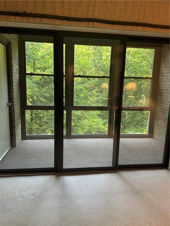 403 Piper Ln, Twp Of But Nw, PA 16001 - doorway to outside featuring carpet and plenty of natural light