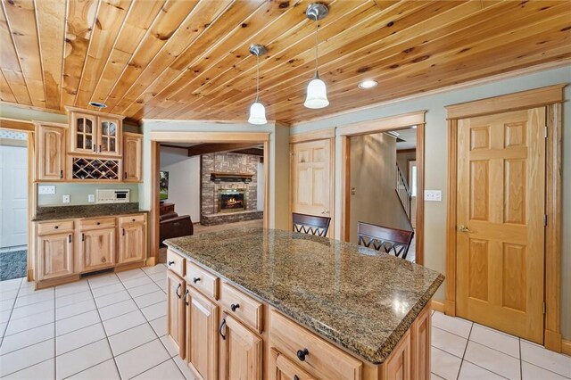 205 Elmhurst Cir, Cranberry Twp, PA 16066 - kitchen with light tile patterned flooring, wood ceiling, a center island, glass insert cabinets, and light brown cabinets