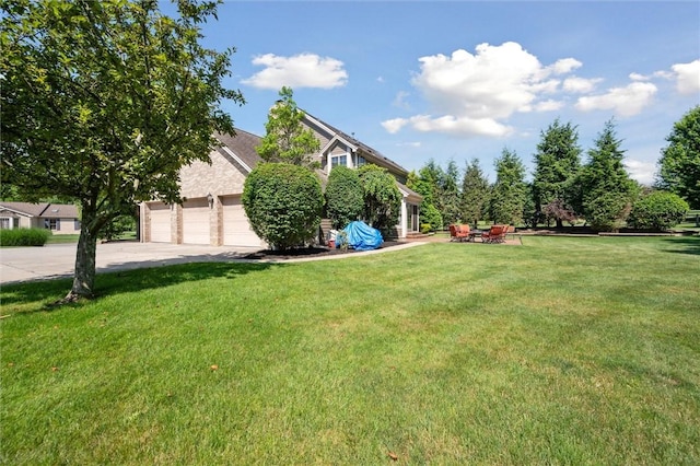 205 Elmhurst Cir, Cranberry Twp, PA 16066 - view of green lawn featuring driveway and a garage