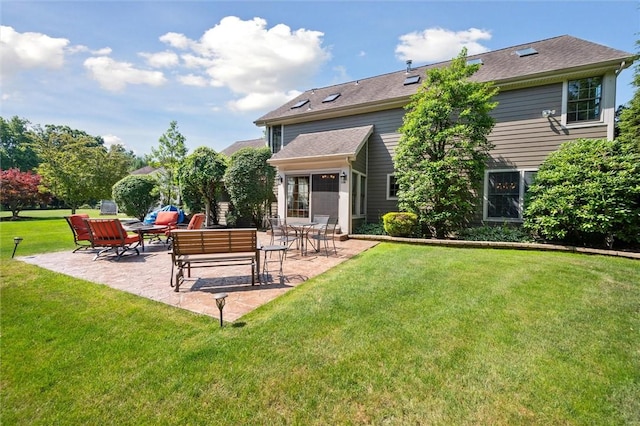205 Elmhurst Cir, Cranberry Twp, PA 16066 - back of property with a patio area and a yard