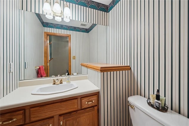 205 Elmhurst Cir, Cranberry Twp, PA 16066 - bathroom featuring wallpapered walls, vanity, and a chandelier