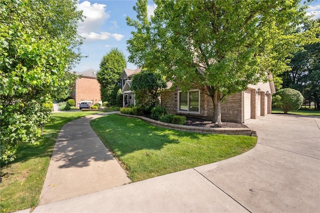 205 Elmhurst Cir, Cranberry Twp, PA 16066 - view of property hidden behind natural elements featuring driveway, a garage, a front lawn, and brick siding