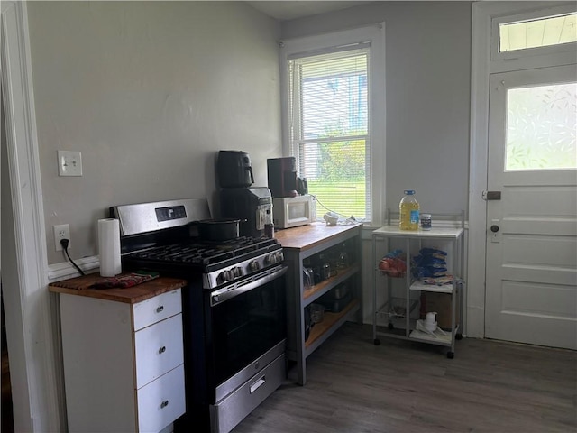 150 N Ave E, Pittsburgh, PA 15112 - kitchen with gas stove, light wood-style floors, white microwave, butcher block countertops, and white cabinets