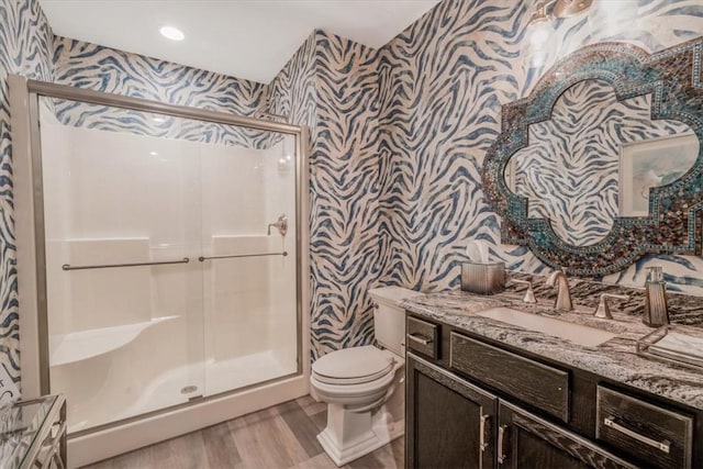 155 Chavelle Ct, Plum Boro, PA 15239 - bathroom featuring wallpapered walls, vanity, wood finished floors, and a stall shower
