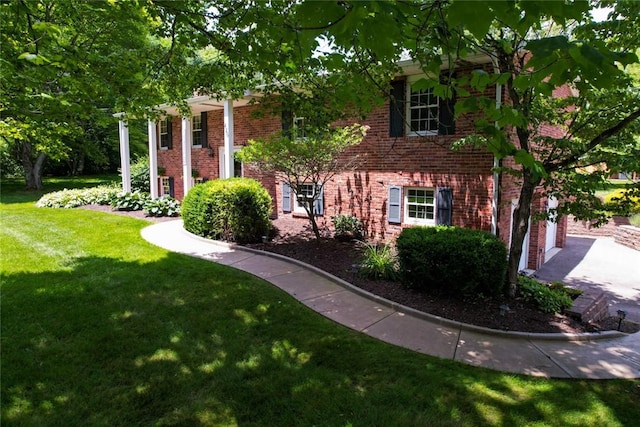 426 Unionville Rd, Franklin Twp, PA 16001 - view of front of property featuring brick siding, a front lawn, and a garage