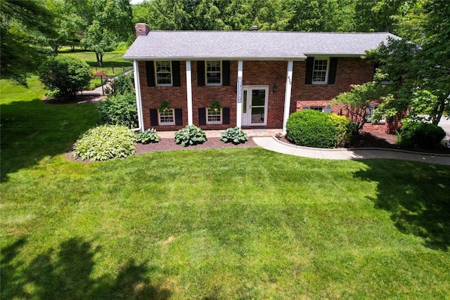 426 Unionville Rd, Franklin Twp, PA 16001 - raised ranch with a chimney, brick siding, a front yard, and roof with shingles
