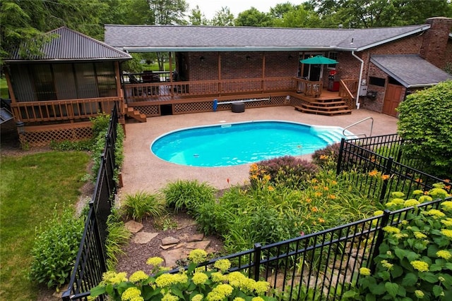 426 Unionville Rd, Franklin Twp, PA 16001 - swimming pool featuring a wooden deck, stairway, a patio, and a sunroom