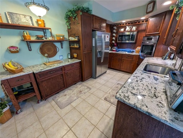 426 Unionville Rd, Franklin Twp, PA 16001 - kitchen featuring appliances with stainless steel finishes, open shelves, light tile patterned floors, and light stone counters