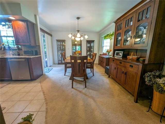 426 Unionville Rd, Franklin Twp, PA 16001 - dining room featuring a chandelier, ornamental molding, light carpet, and light tile patterned flooring