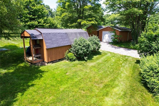 426 Unionville Rd, Franklin Twp, PA 16001 - view of grassy yard with a detached garage and a shed