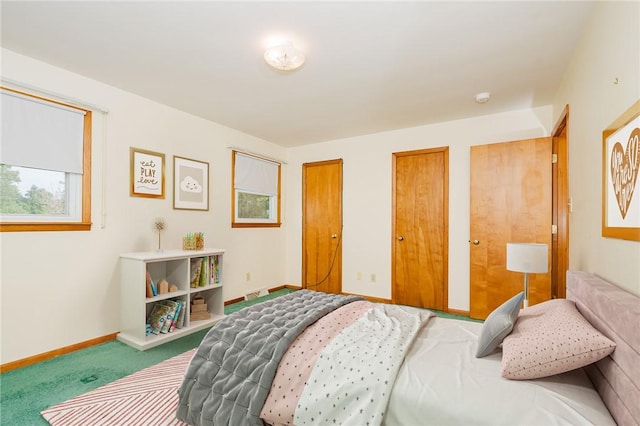 125 Jackson St, White Twp, PA 15701 - carpeted bedroom featuring multiple closets and baseboards