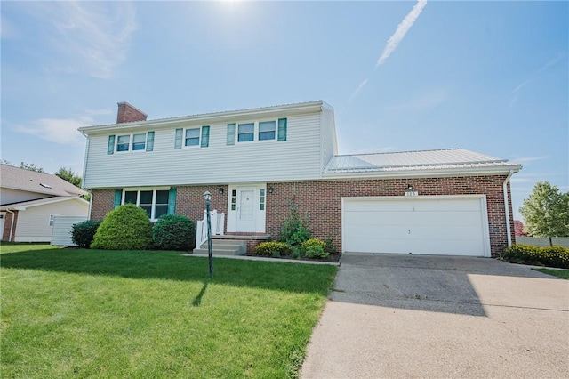 125 Jackson St, White Twp, PA 15701 - colonial-style house with brick siding, driveway, a chimney, and an attached garage
