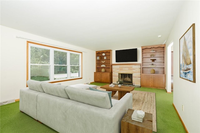 125 Jackson St, White Twp, PA 15701 - living room featuring a stone fireplace, carpet, and built in shelves