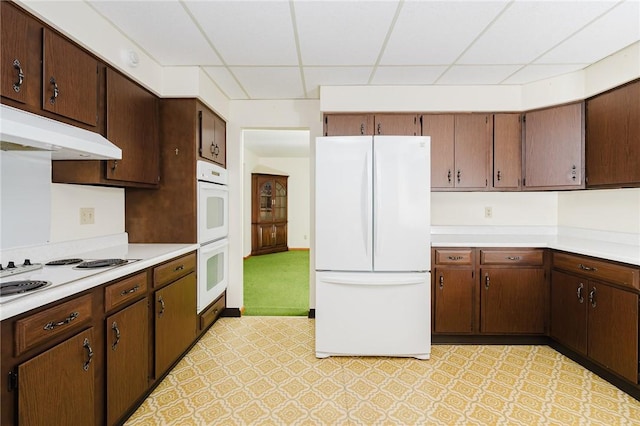 125 Jackson St, White Twp, PA 15701 - kitchen with white appliances, light countertops, a paneled ceiling, under cabinet range hood, and light flooring