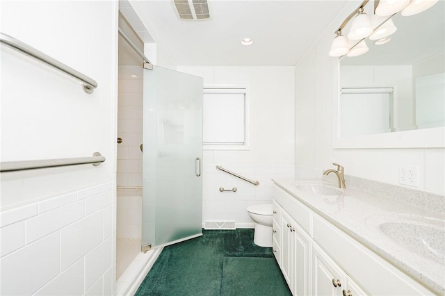 125 Jackson St, White Twp, PA 15701 - bathroom with a stall shower, double vanity, tile walls, and recessed lighting