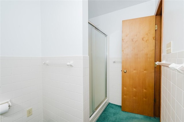 125 Jackson St, White Twp, PA 15701 - bathroom featuring tile walls, a stall shower, and wainscoting