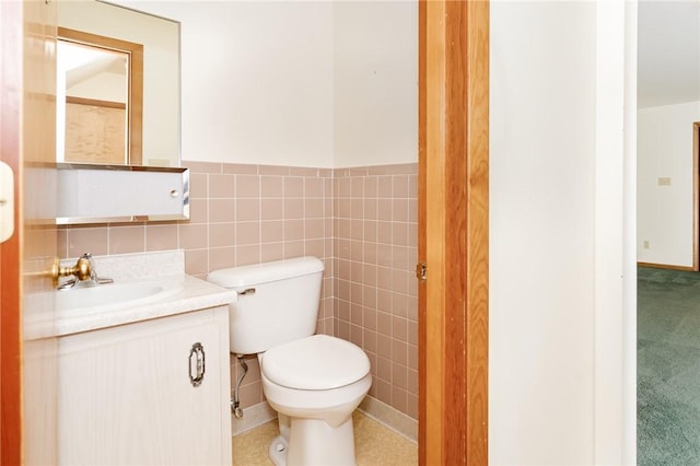 125 Jackson St, White Twp, PA 15701 - bathroom featuring vanity, a wainscoted wall, and tile walls