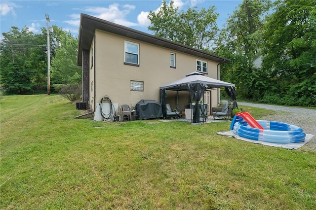 3640 Bakerstown Rd, Richland, PA 15044 - back of property featuring a gazebo, a lawn, and stucco siding