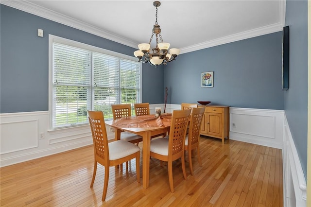 1100 Eleanor Pl, Adams Twp, PA 15044 - dining area with a chandelier, healthy amount of natural light, a wainscoted wall, ornamental molding, and light wood-type flooring