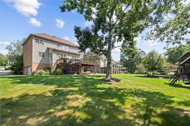 1100 Eleanor Pl, Adams Twp, PA 15044 - view of green lawn featuring a deck, an attached garage, and a playground