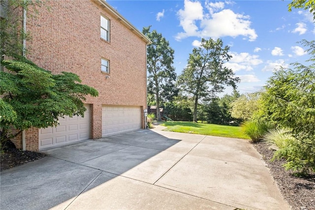 1100 Eleanor Pl, Adams Twp, PA 15044 - view of property exterior with a garage, concrete driveway, and a lawn
