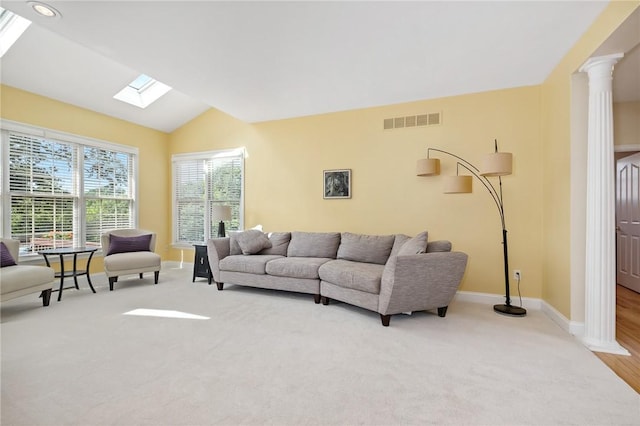 1100 Eleanor Pl, Adams Twp, PA 15044 - living room with a skylight, ornate columns, vaulted ceiling, and carpet
