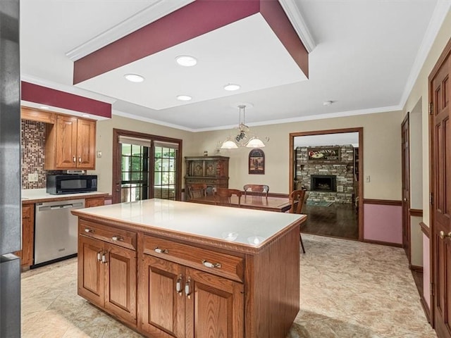 4273 River Rd, North Sewickley Twp, PA 15010 - kitchen with dishwasher, black microwave, brown cabinetry, light countertops, and crown molding