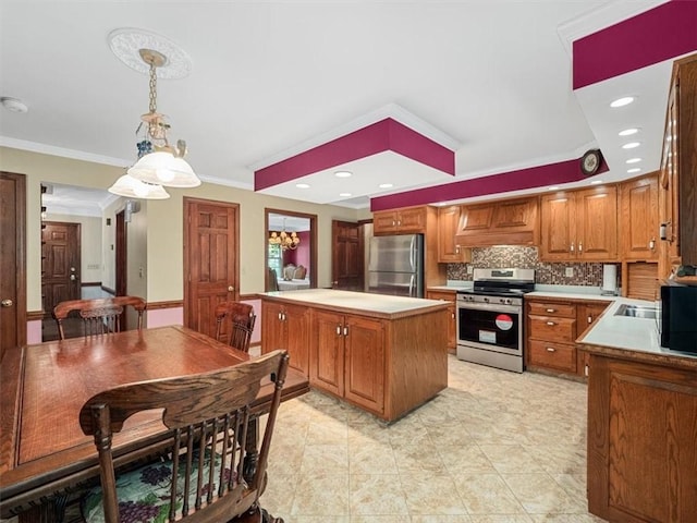 4273 River Rd, North Sewickley Twp, PA 15010 - kitchen with stainless steel appliances, a kitchen island, ornamental molding, tasteful backsplash, and brown cabinets