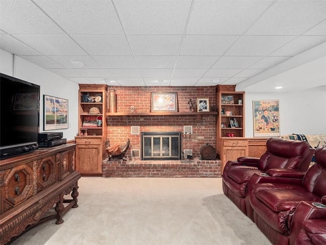 4273 River Rd, North Sewickley Twp, PA 15010 - carpeted living area with a brick fireplace, built in features, a drop ceiling, and brick wall