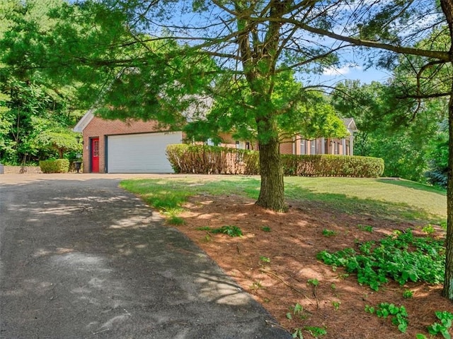 4273 River Rd, North Sewickley Twp, PA 15010 - view of front of house featuring brick siding, a garage, a front lawn, and driveway