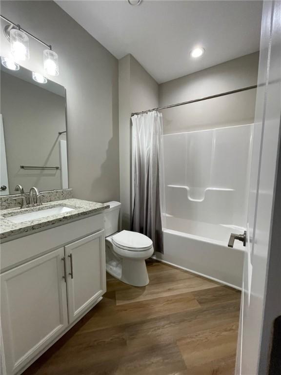 4252 Hawthorn Dr, South Park, PA 15129 - full bathroom featuring shower / bath combo, wood finished floors, vanity, and recessed lighting