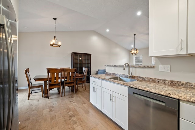 212 Olivia Dr, Plum Boro, PA 15068 - kitchen featuring stainless steel appliances, light wood-style flooring, white cabinetry, vaulted ceiling, and light stone countertops