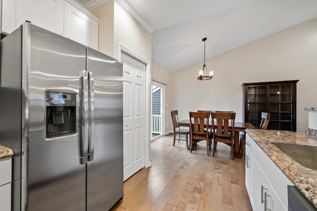 212 Olivia Dr, Plum Boro, PA 15068 - kitchen featuring stainless steel fridge with ice dispenser, light wood-type flooring, lofted ceiling, white cabinetry, and light stone countertops
