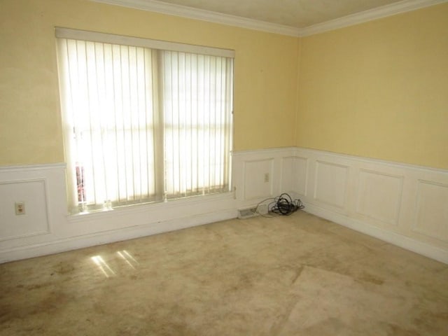 458 Wendel Rd, Hempfield Twp, PA 15642 - carpeted spare room with a decorative wall, ornamental molding, and a wainscoted wall
