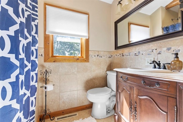 207 High Acres Rd, Lancaster Twp, PA 16037 - full bathroom featuring vanity, tile walls, a shower with curtain, and wainscoting