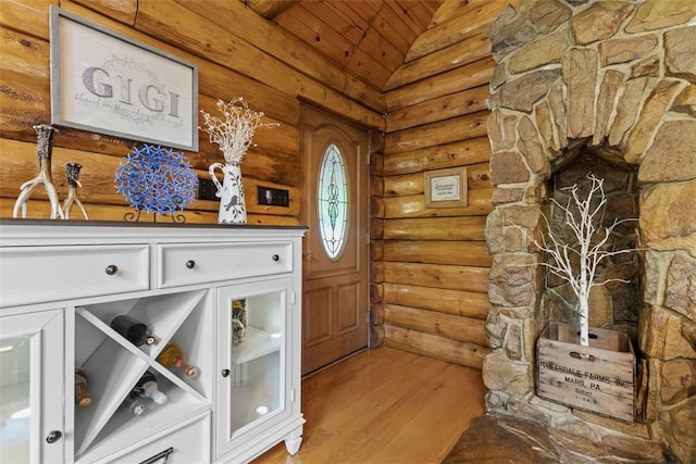 207 High Acres Rd, Lancaster Twp, PA 16037 - entrance foyer featuring lofted ceiling, log walls, wooden ceiling, and wood finished floors