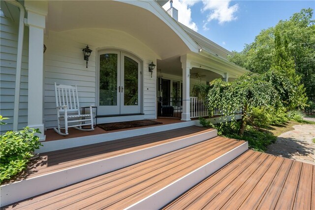 16 Mcdowell Rd, Ligonier Twp, PA 15658 - wooden porch featuring french doors and a ceiling fan