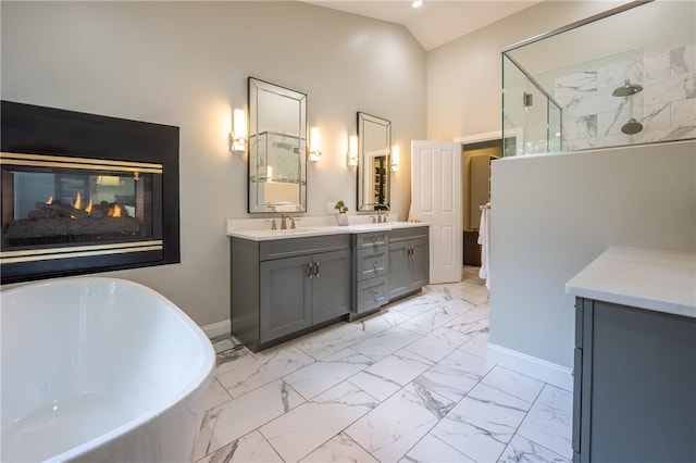 16 Mcdowell Rd, Ligonier Twp, PA 15658 - bathroom with a freestanding bath, marble finish floors, double vanity, a walk in shower, and high vaulted ceiling