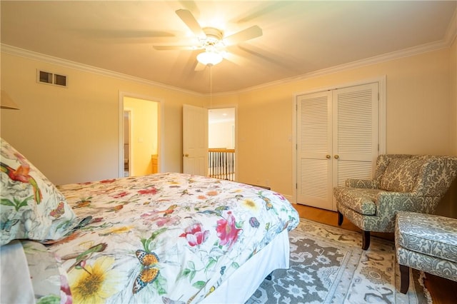 16 Mcdowell Rd, Ligonier Twp, PA 15658 - bedroom featuring wood finished floors, ornamental molding, a closet, and a ceiling fan