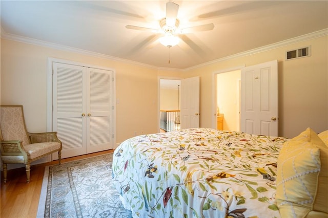 16 Mcdowell Rd, Ligonier Twp, PA 15658 - bedroom featuring crown molding, a closet, wood finished floors, and a ceiling fan
