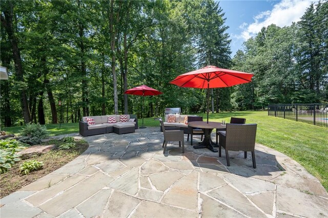 16 Mcdowell Rd, Ligonier Twp, PA 15658 - view of patio / terrace with an outdoor hangout area, outdoor dining area, and view of wooded area