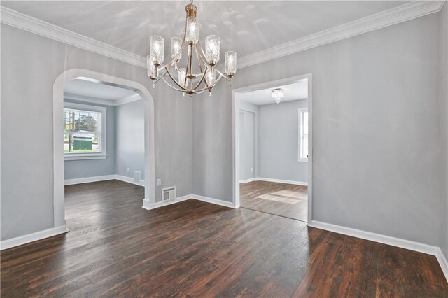 200 Thomas St, West Mifflin, PA 15122 - spare room featuring arched walkways, dark wood-style floors, ornamental molding, and a chandelier