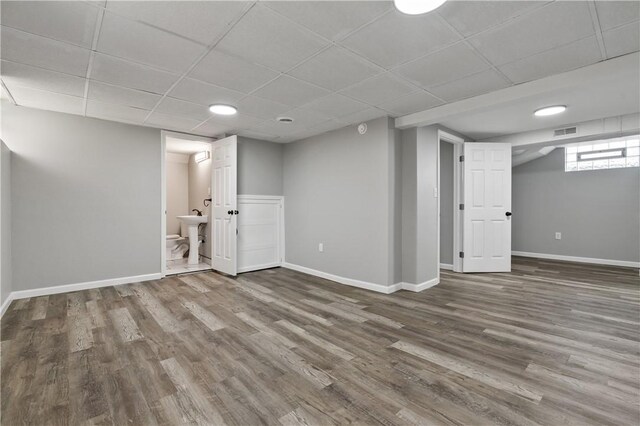 200 Thomas St, West Mifflin, PA 15122 - below grade area featuring a drop ceiling and wood finished floors